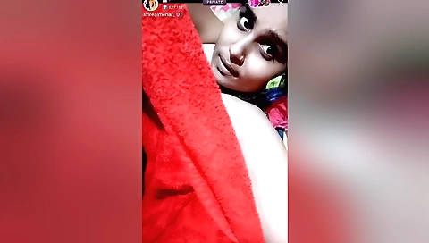 A sexy brunette in a black dress plays with her hairy body