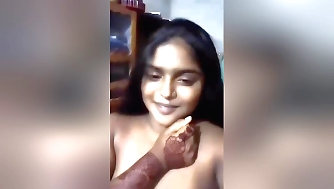 Sexy brunette in sexy lingerie showing her huge tits