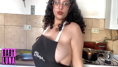Sexy solo female in apron is showing off her tits and face