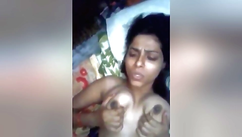 Indian solo chick enjoys her large tits on the webcam