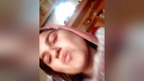 Amateur brunette making out with a guy in front of the camera