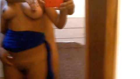 Busty woman in a sexy black dress with her sexy body is naked