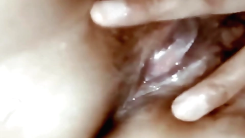 Indian hairy woman is on the massage table with hairy pussy