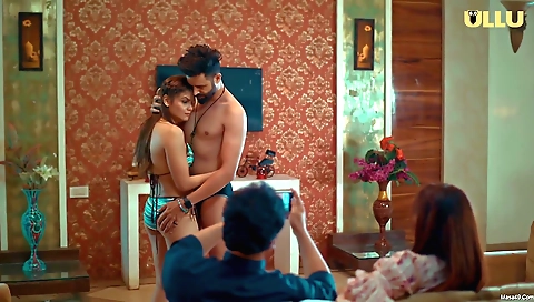 Red-haired babe is wearing a red blouse and is showing off her body