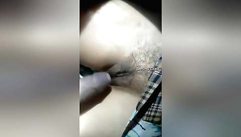 Indian hairy chick fucks in her shaved pussy in the view video