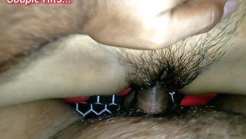 Indian teen is getting a load of water on her hairy pussy