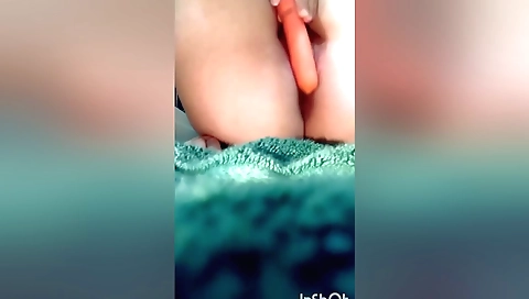 Slender girl 18+ masturbates with a plastic carrot