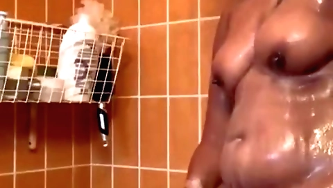 Busty brunette makes a homemade video in her shower