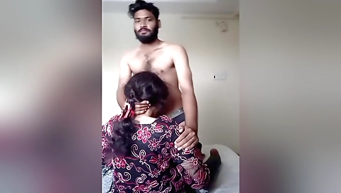 Indian girl in her traditional dress is in the hotle room