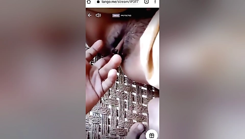 Busty brunette with hairy pussy showing fingers in front of camera