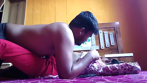 Indian whore in her bedroom sucking her husband's cock