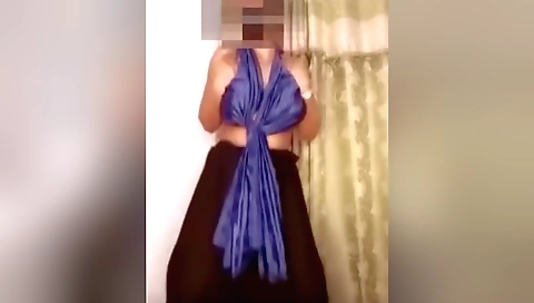 Beautiful brunette woman with a nice body is dancing