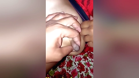 A horny man loves to play with his wife's big boobs