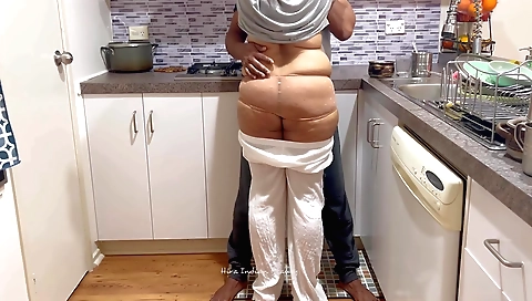 Chubby brunette gets nailed in the kitchen by a guy